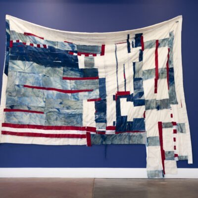 Alexandra Robinson, Los Intersticios (of no place/no time-Francisca's House), 2020-2022 cyanotype on cotton muslin, cotton batting and American flags quilted