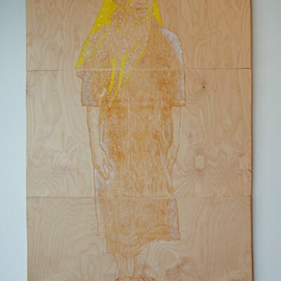 wood burning of a woman with a yellow veil in acrylic paint titled Ghost by Lahib Jaddo