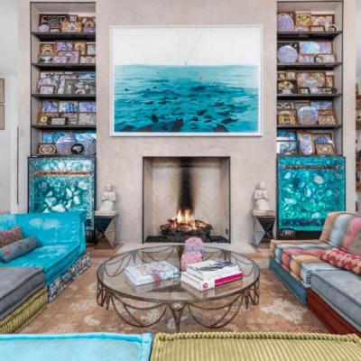 Photograph of a colorful living room with a fireplace
