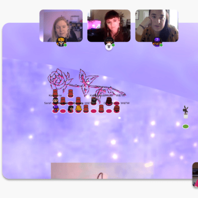 screenshot of a video game-like screen with participants videos at the top of screen while they overlook their avatars