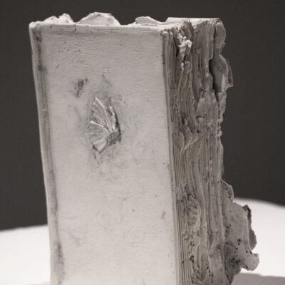 white sculpture of a thick book