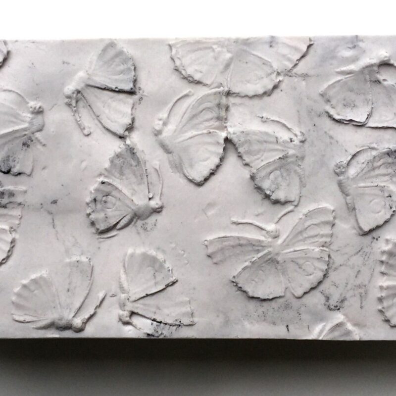 Jill Bedgood; Brick: Moths; cast hydrocal, powdered graphite, marble dust, 8" x 3.75" x 2.5"