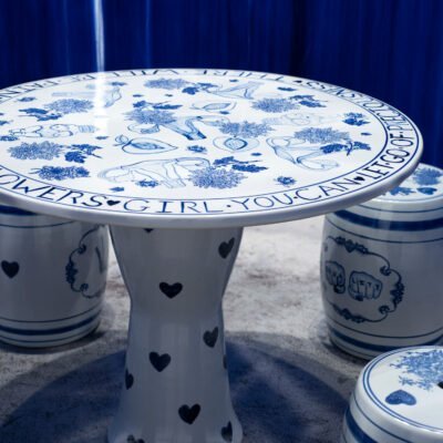 porcelain table with blue designs of the uterus, and flowers.