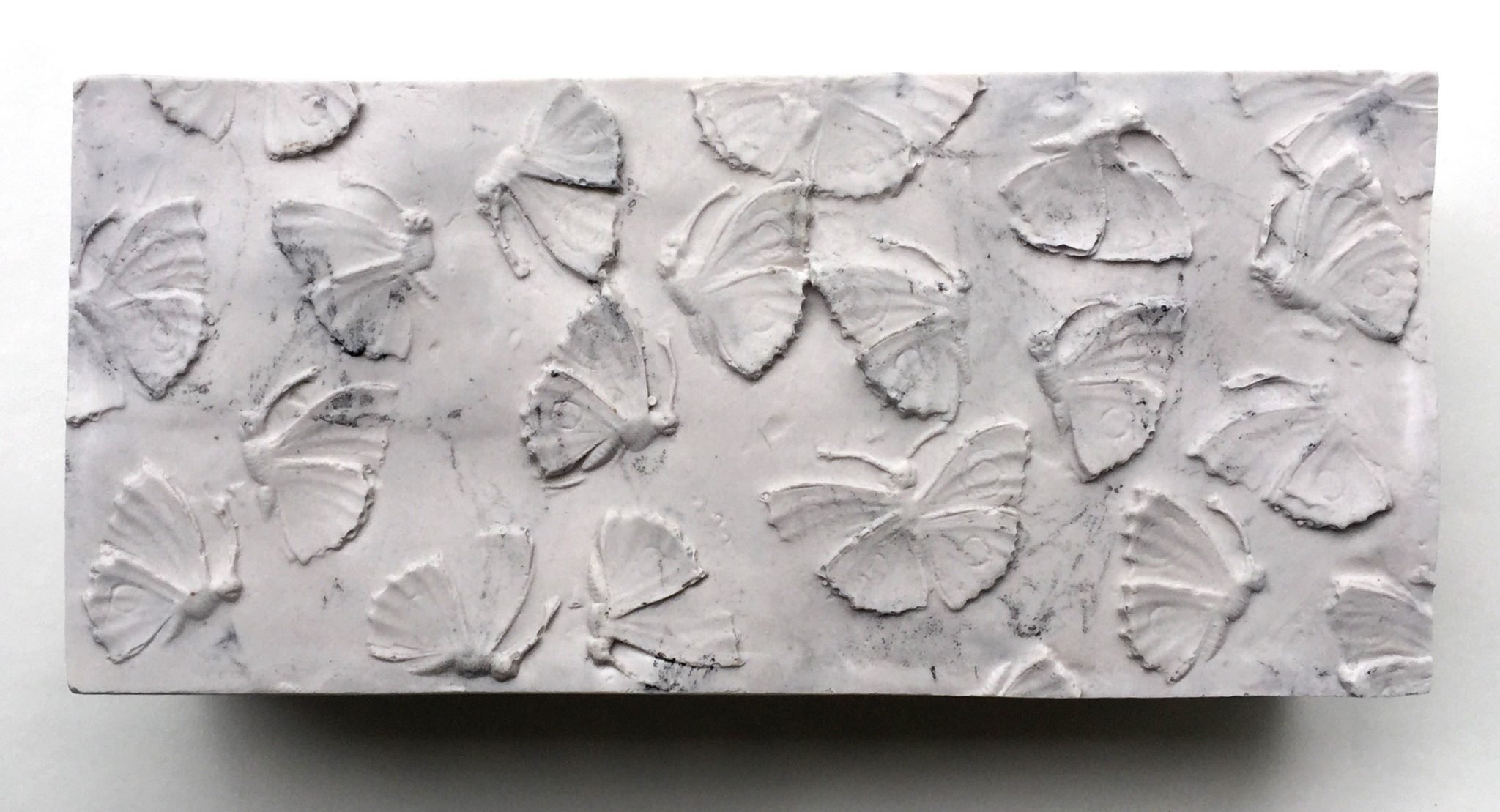 Jill Bedgood, "Moth Bricks", Cast plaster, powdered graphite, 8" x 3-3/4" x 2-1/2"